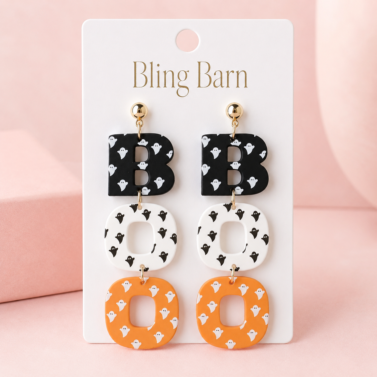 Ghostly BOO Statement Earrings displayed on Bling Barn jewelry card against soft pink background