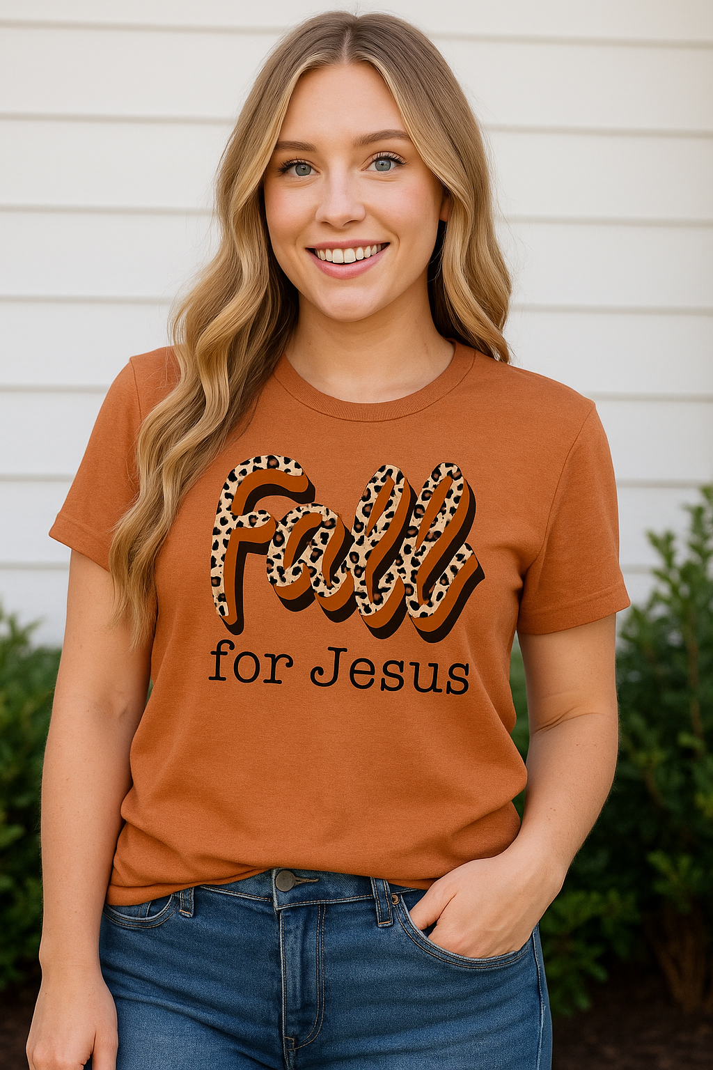 Woman wearing a rust-colored "Fall for Jesus" leopard print graphic tee with short sleeves and a unisex fit.