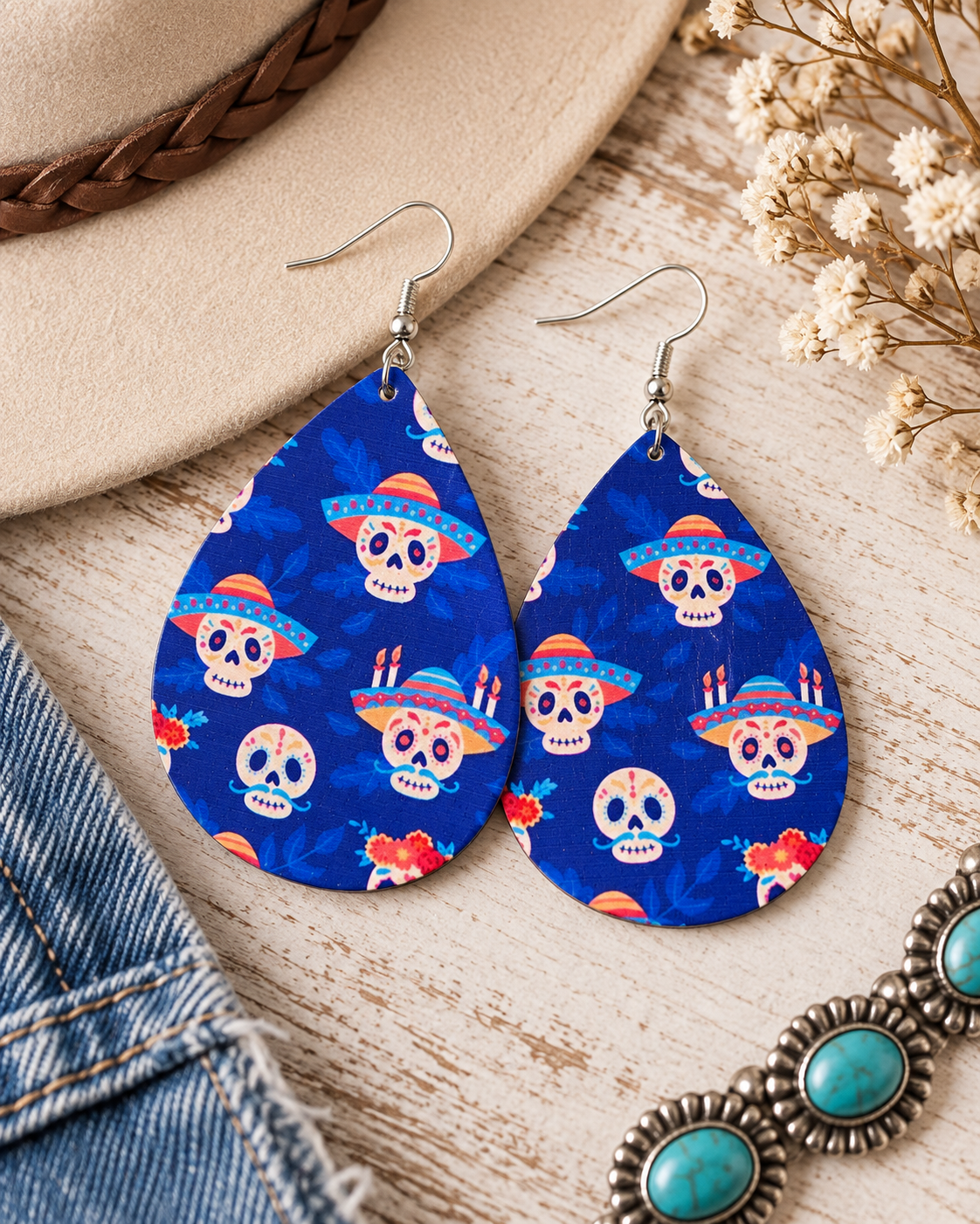 Fiesta Azul wood earrings styled with denim, neutral western accessories, and soft floral accents