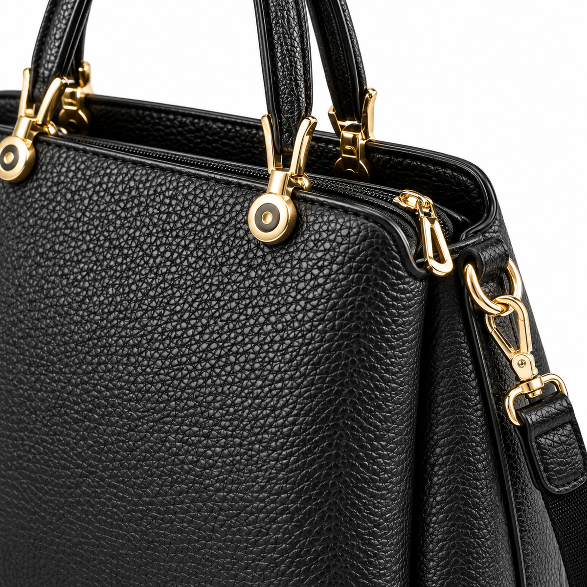 Open black faux leather top handle tote bag showing spacious interior, zipper closure and interior organization