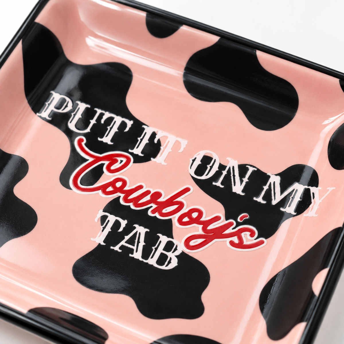 Close-up detail of Put It On My Cowboys Tab square ceramic trinket tray
