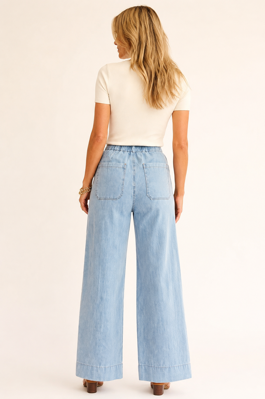 Back view of the Blue Haven wide-leg jeans showing the high waist, large back patch pockets and full-length legs.
