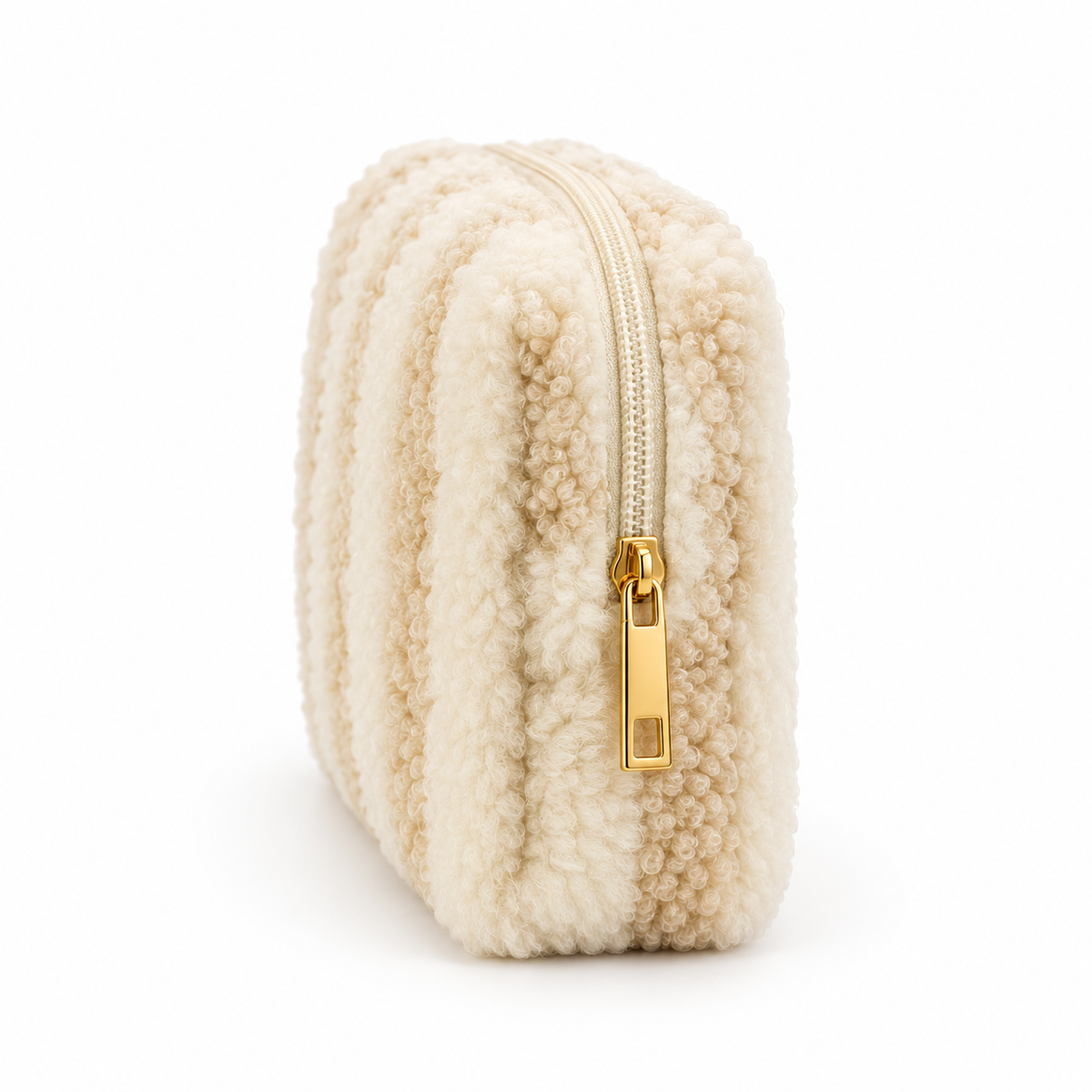 Side view of ivory striped bouclé cosmetic pouch showing slim structured shape and zipper
