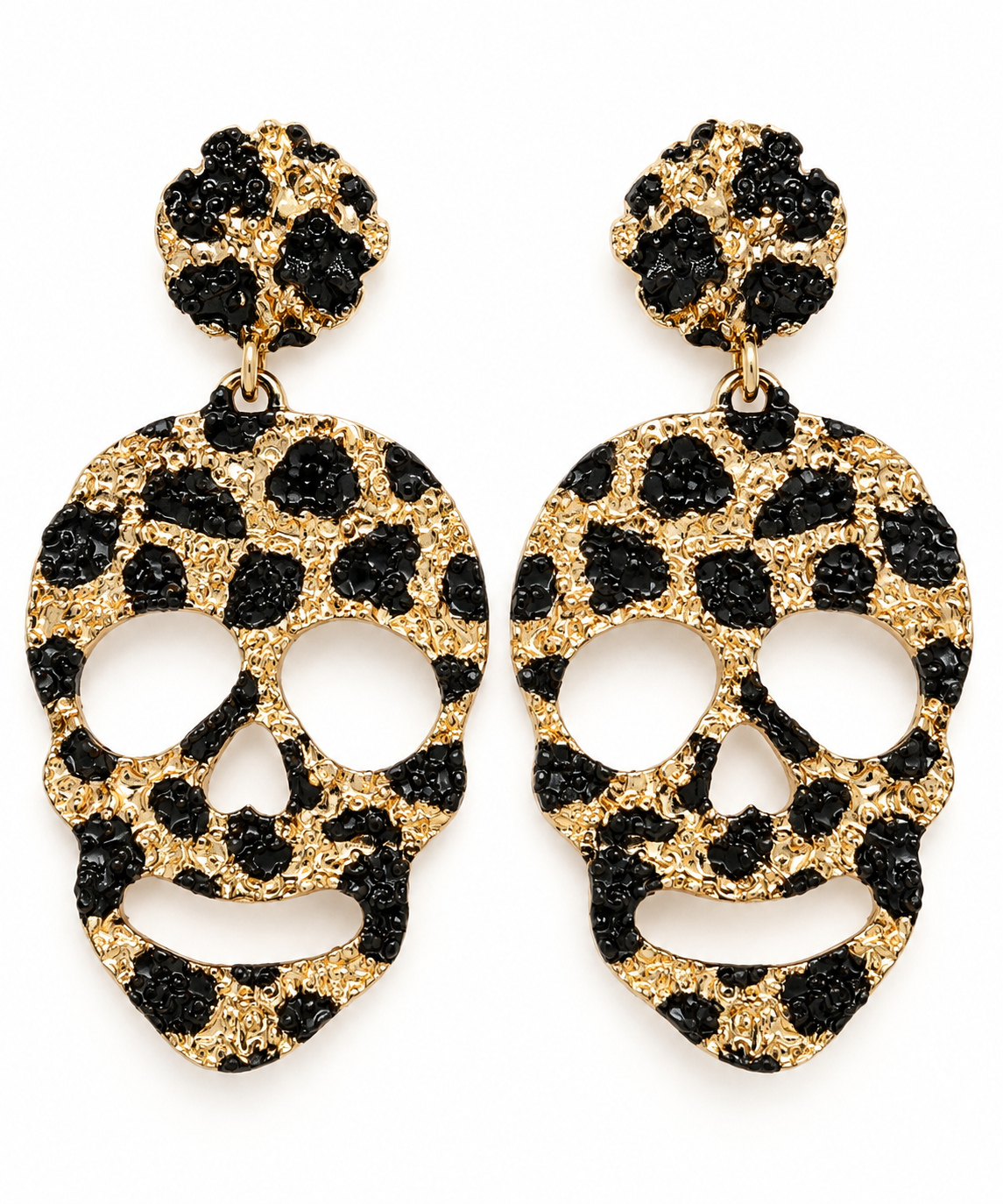 A pair of gold and black leopard-print skull drop earrings on a plain white background.