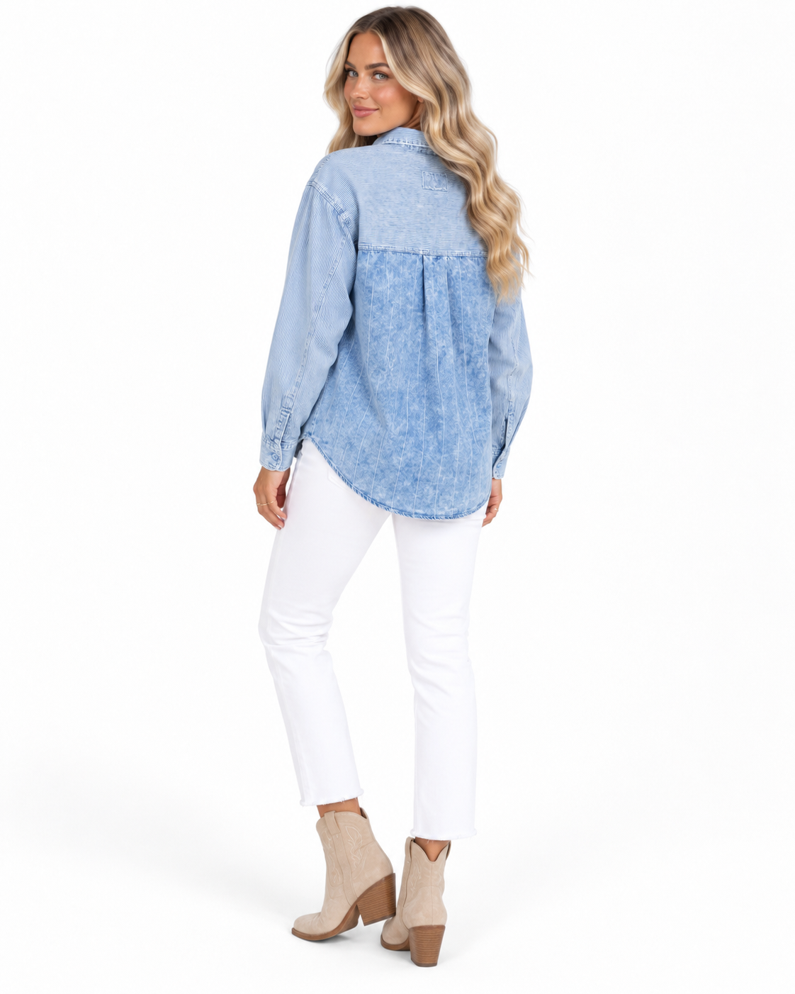 A woman modeling a light blue patterned long-sleeve blouse with white pants and beige ankle boots, shown from the back against a plain white studio background.