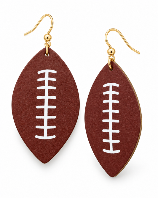 Friday Night Lights football drop earrings with deep brown football shapes, white lace details, and gold-tone hooks on a white background