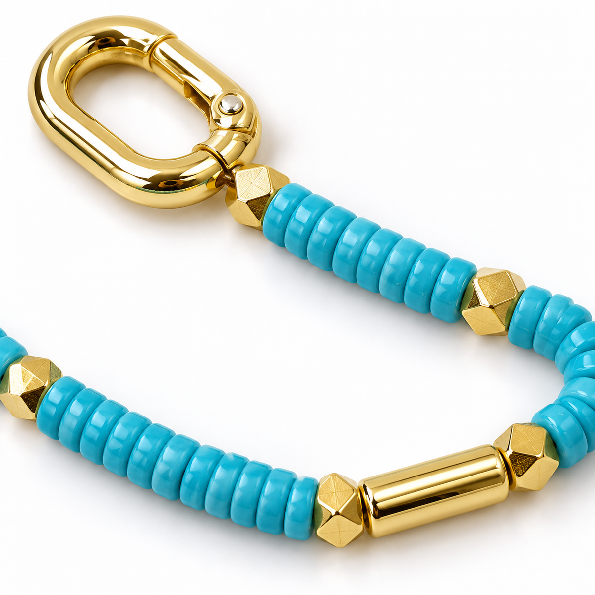 Close-up of faux turquoise acrylic beads and gold-tone clasp on bag charm