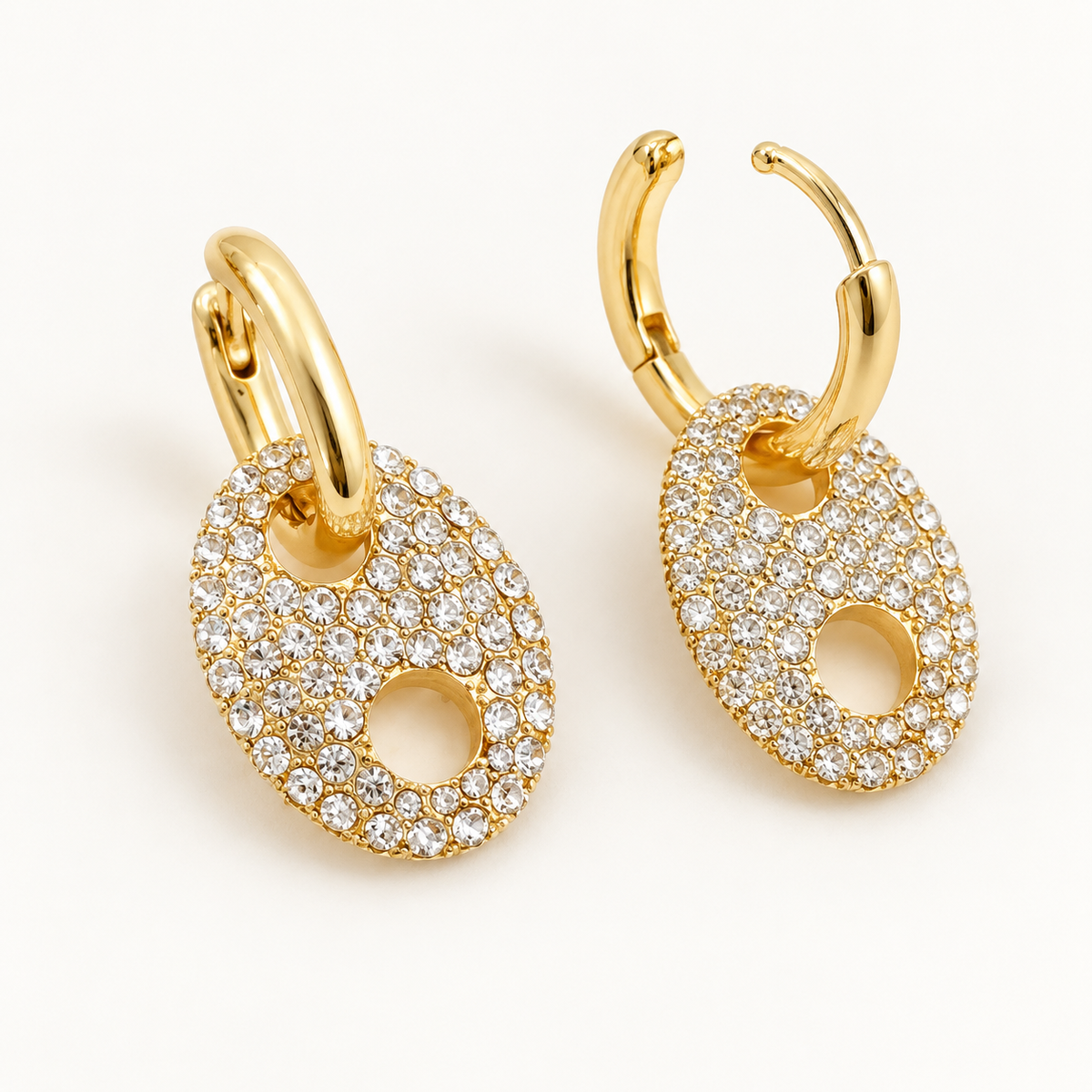 Gold horse bit earrings showing hinged huggie hoop closures