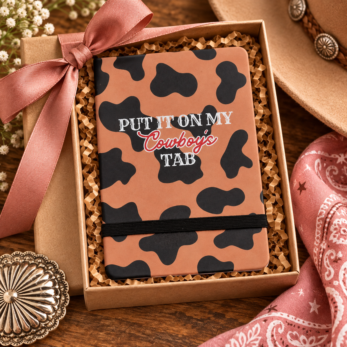 Put It On My Cowboy’s Tab western journal styled in a gift box with pink ribbon and cowgirl accessories