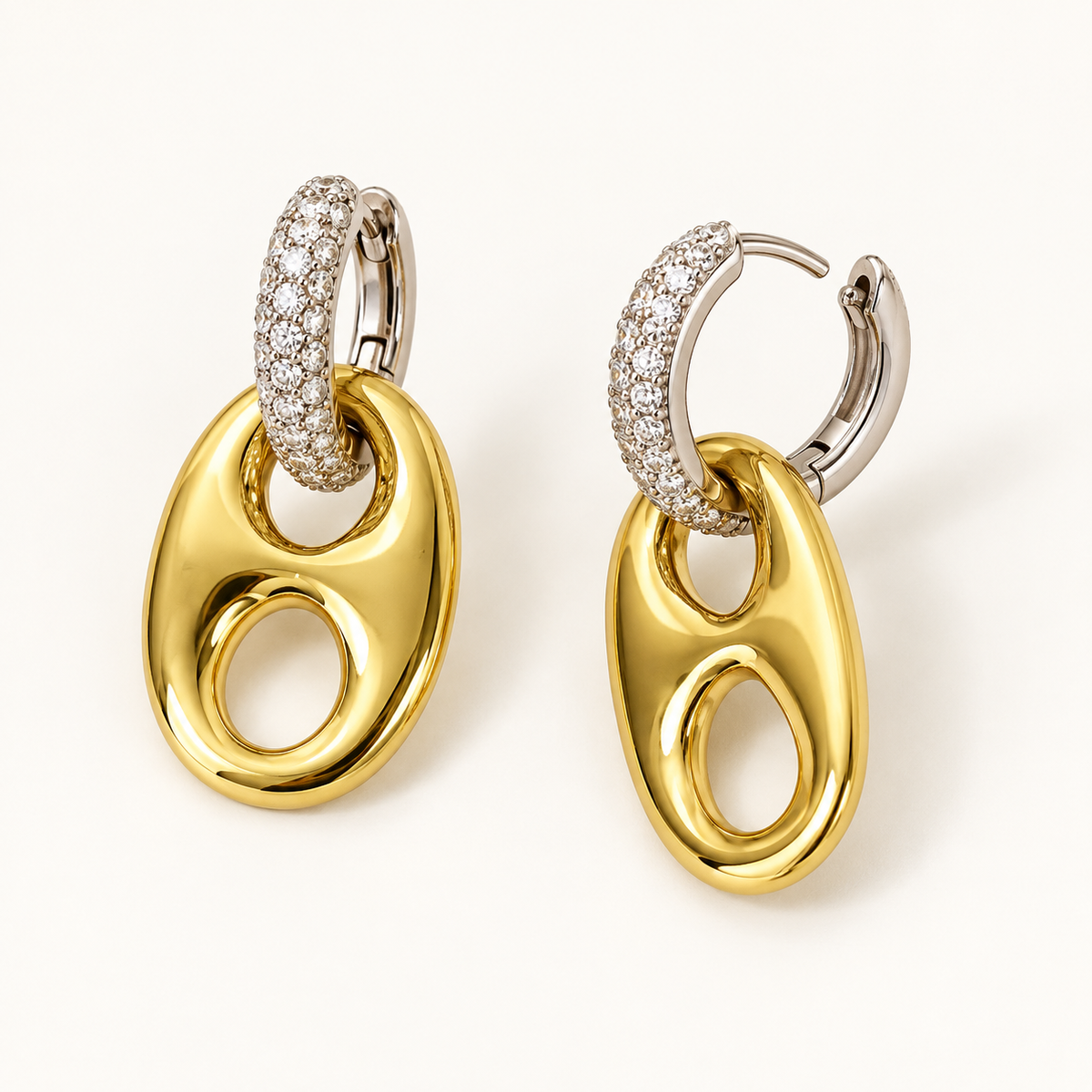 Two-tone horse bit earrings showing hinged huggie hoop closures