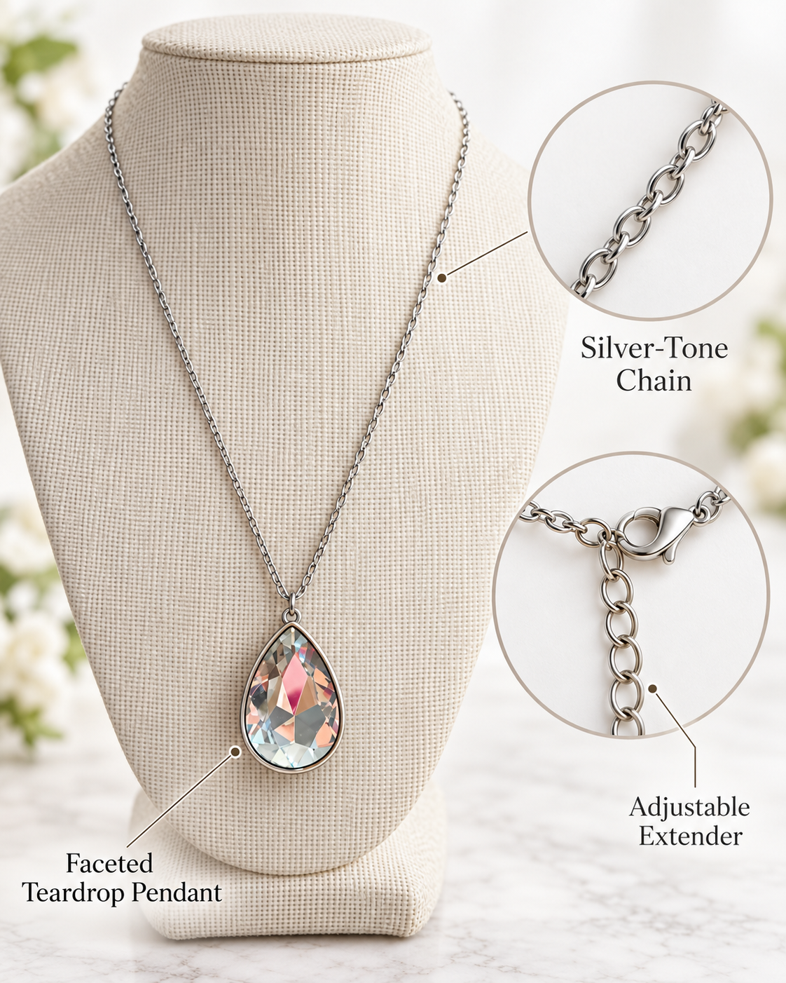Attribute image showing faceted teardrop pendant, silver-tone chain and adjustable extender