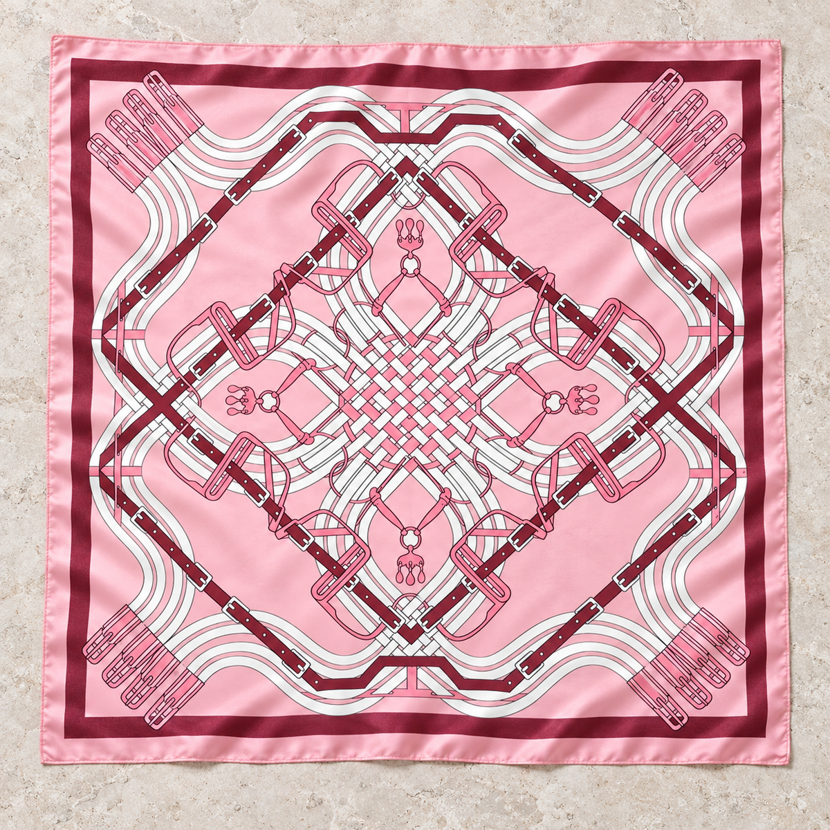 Pink Bridle Maze equestrian square scarf with burgundy straps, buckles, and coordinating border.