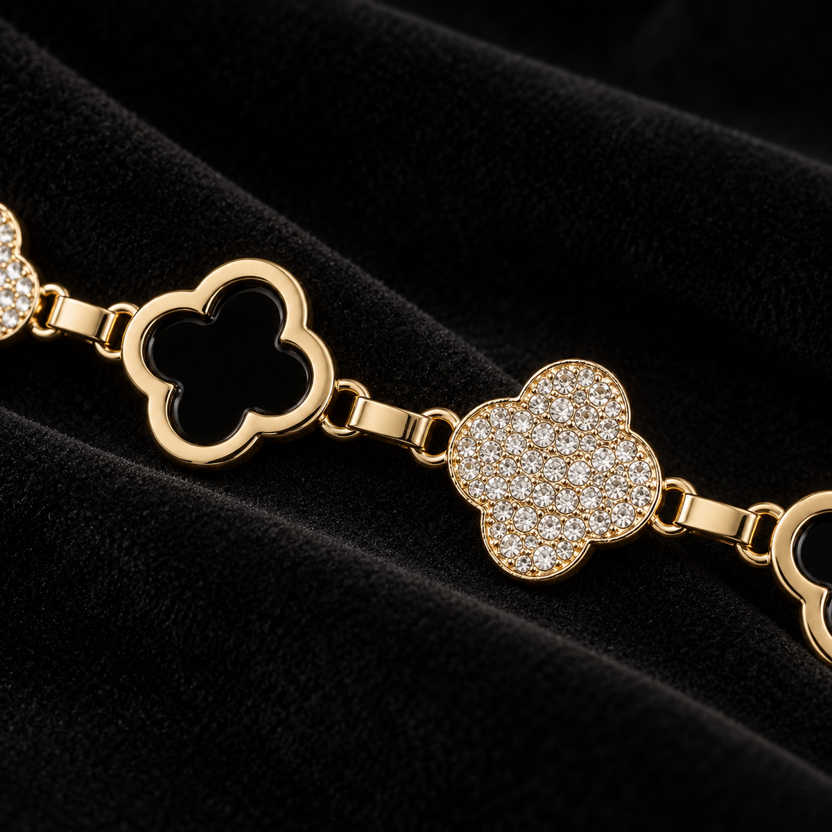 Close-up of gold-tone open quatrefoil and clear rhinestone links on the City Lights chain belt