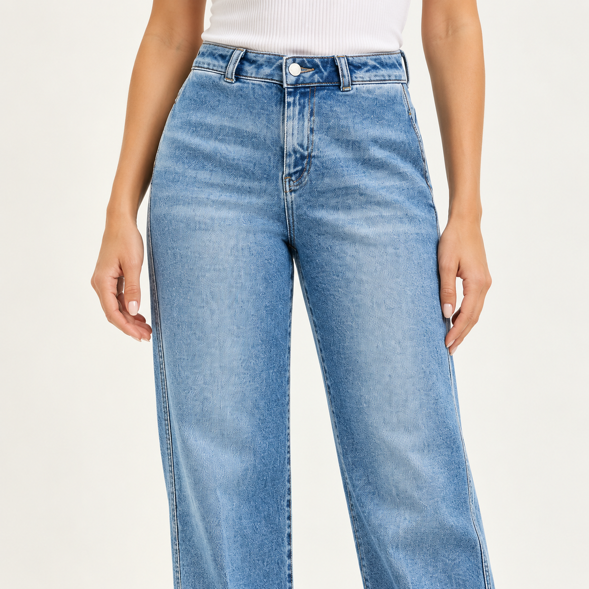 Back view of RISEN slouchy straight jeans showing welt pockets, relaxed fit, and full-length legs.