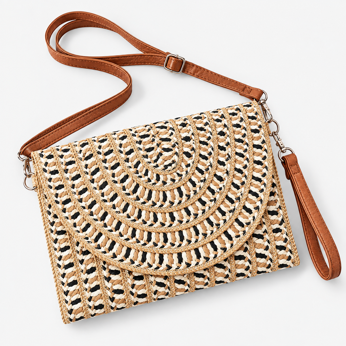 Coastal Mesa woven clutch displayed with detachable cognac wristlet and adjustable crossbody strap