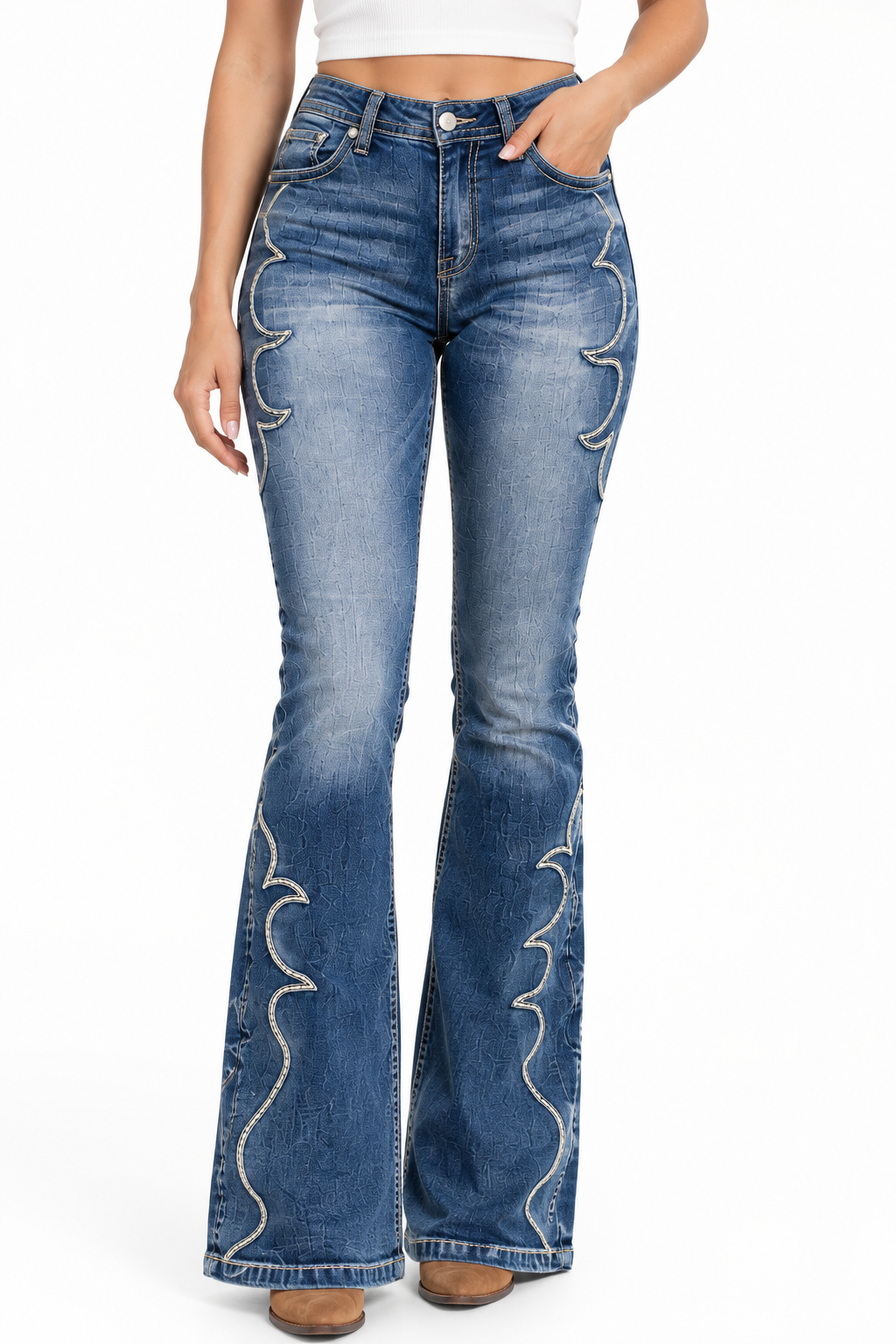 A model wearing a pair of blue denim flare jeans with distinctive white embroidered scallop details running down the front of both legs, shown against a plain white background.