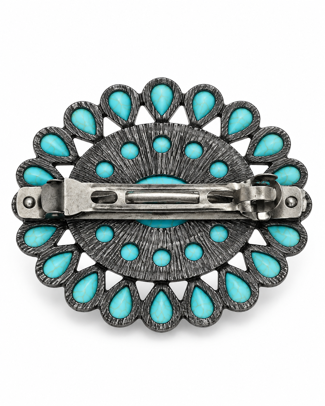 A silver-toned Southwestern-style brooch featuring turquoise inlay, shown from the back to reveal the metal clasp mechanism. The piece has a textured silver frame with scalloped edges and small, medium, and large turquoise stones.