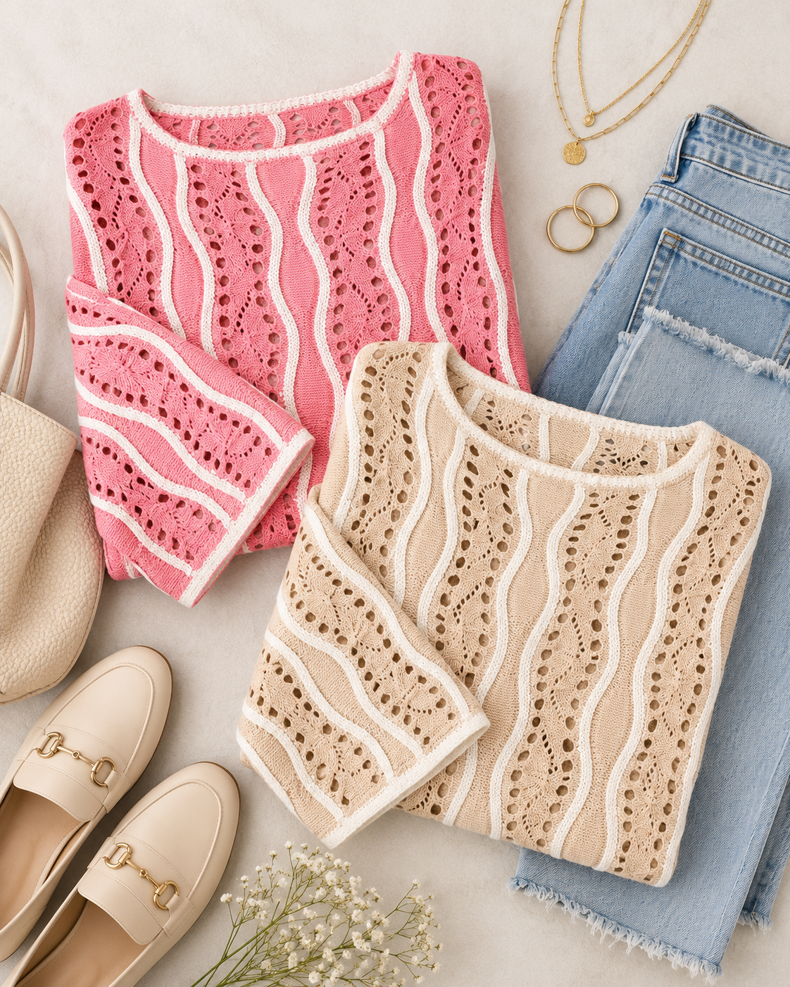 Two folded knit long-sleeve tops with wavy openwork stripes are arranged in a styled flat lay. The top on the left is pink with white stripes, and the top on the right is beige with white stripes.