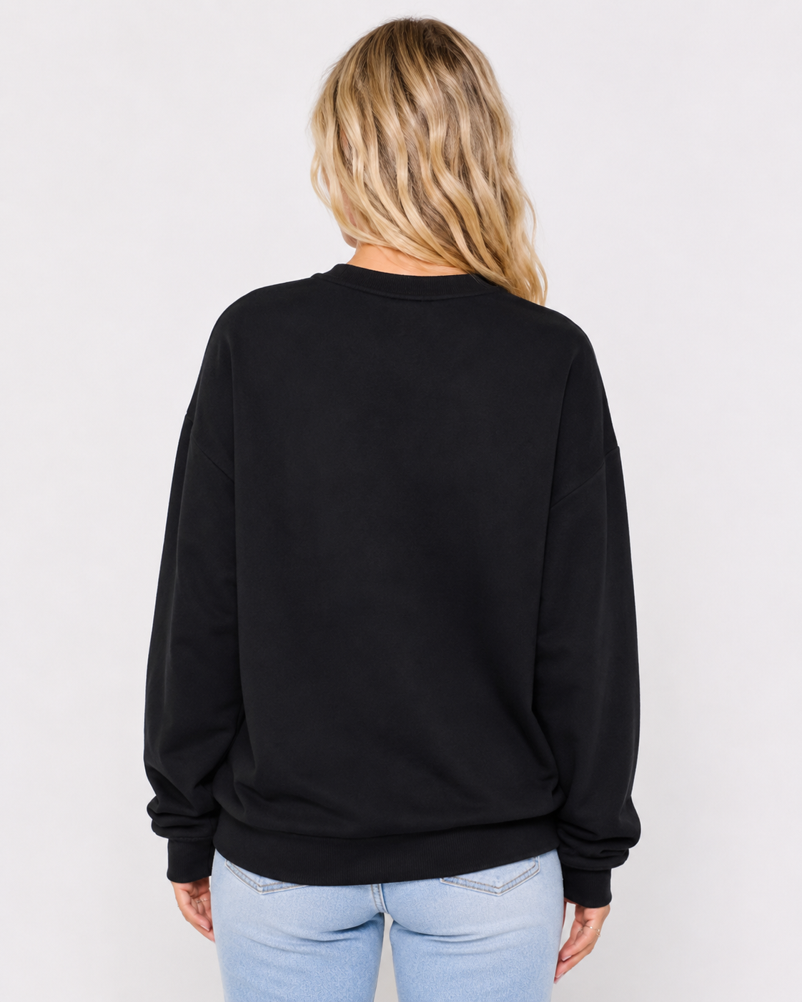 Back view of the black Spooky Rhinestone Sweatshirt showing the plain back, relaxed drop-shoulder silhouette, ribbed hem, and long sleeves.
