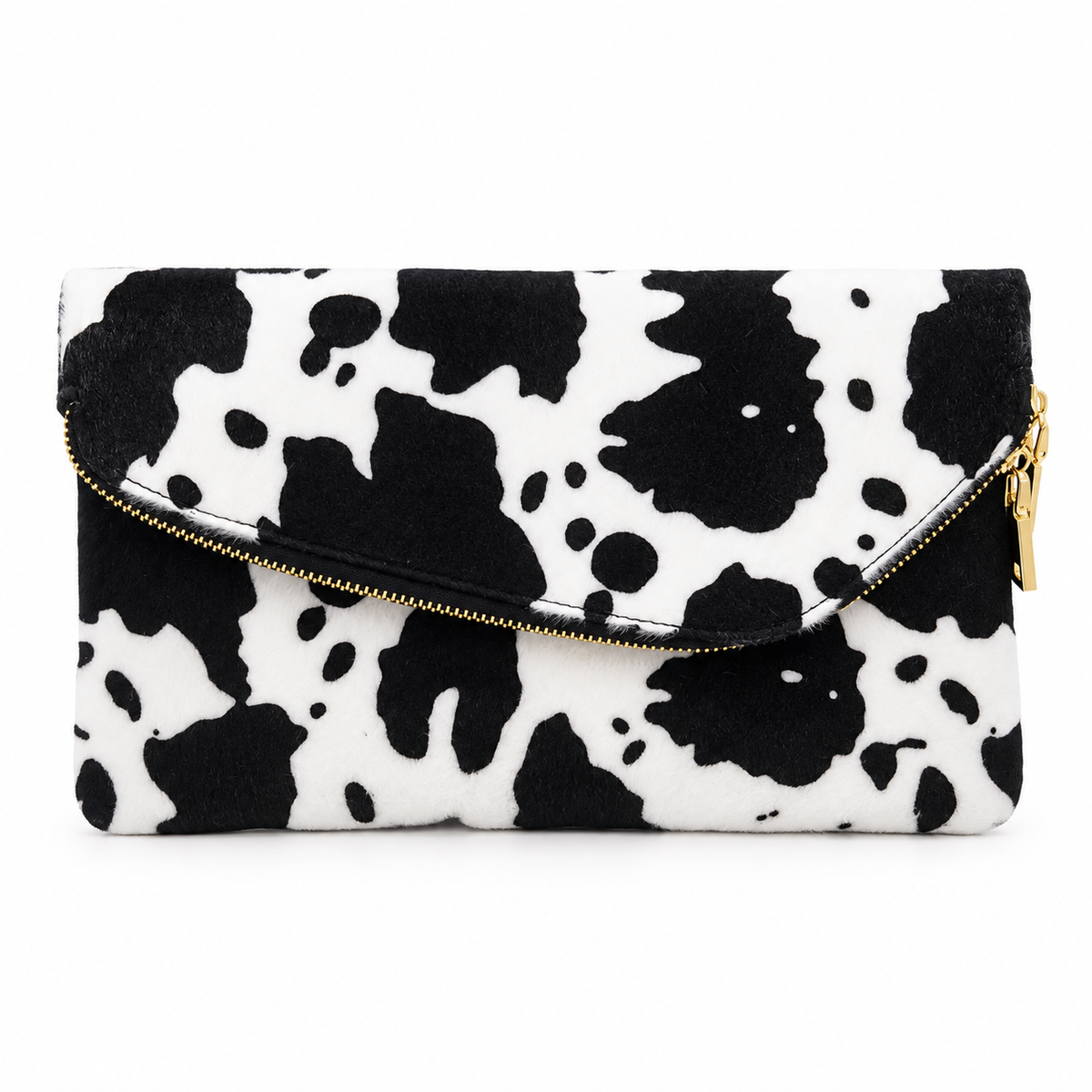 Black and white cow print foldover clutch bag with gold zipper on white background