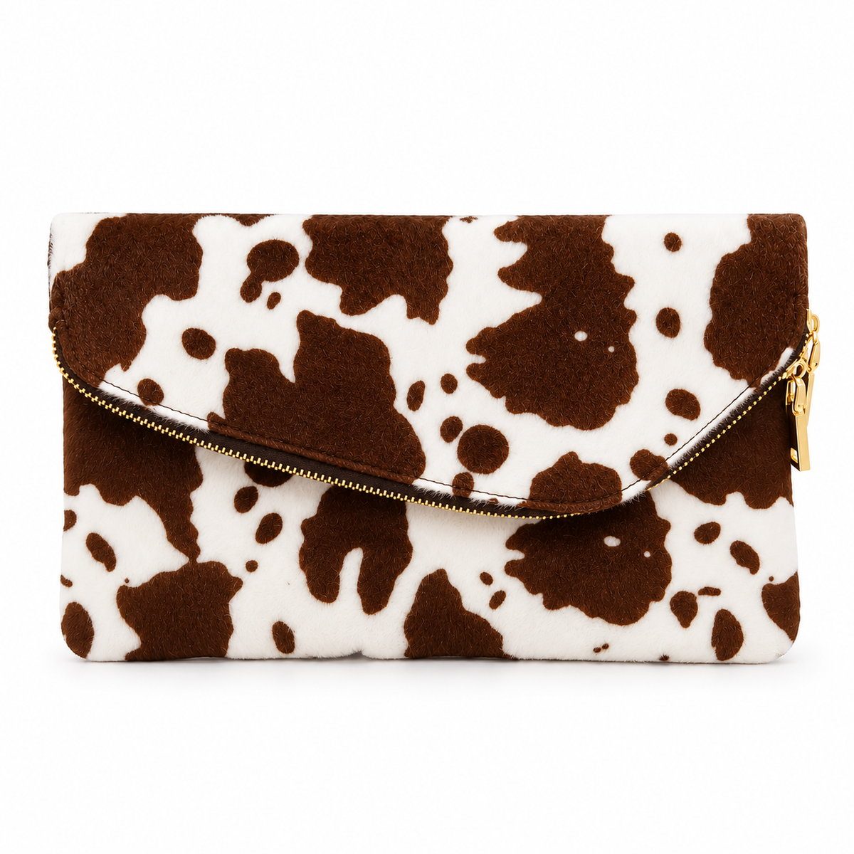 Brown and white cow print foldover clutch bag with gold zipper on white background