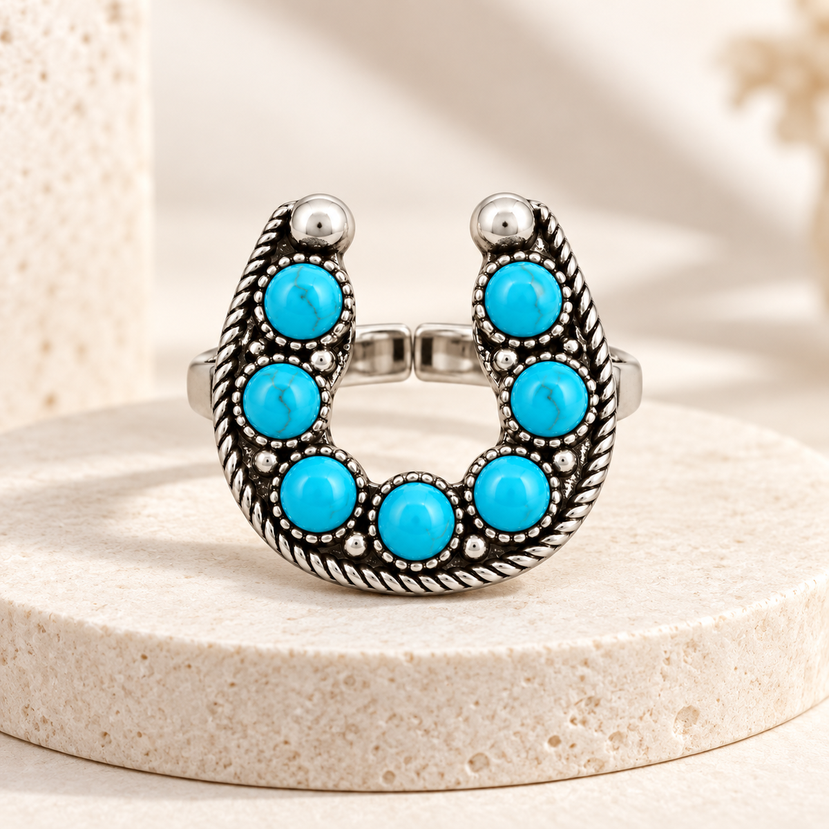 Lucky West horseshoe ring styled with denim, leather and western-inspired textures