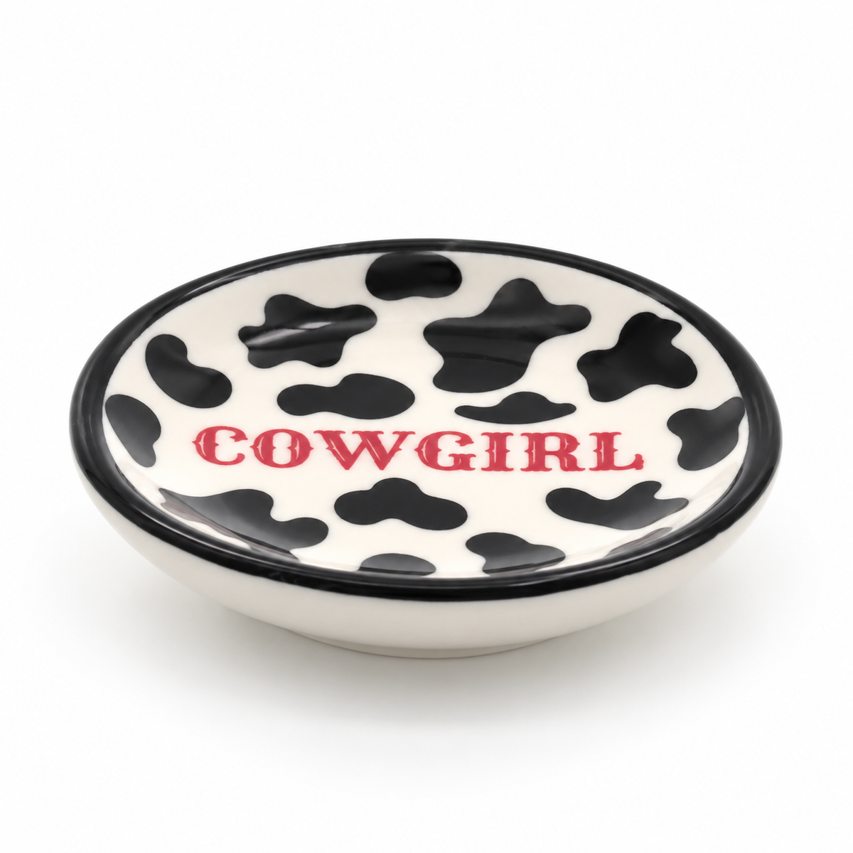Western Cowgirl ceramic jewelry dish styled on a bedside table with rings and cowboy boot earrings