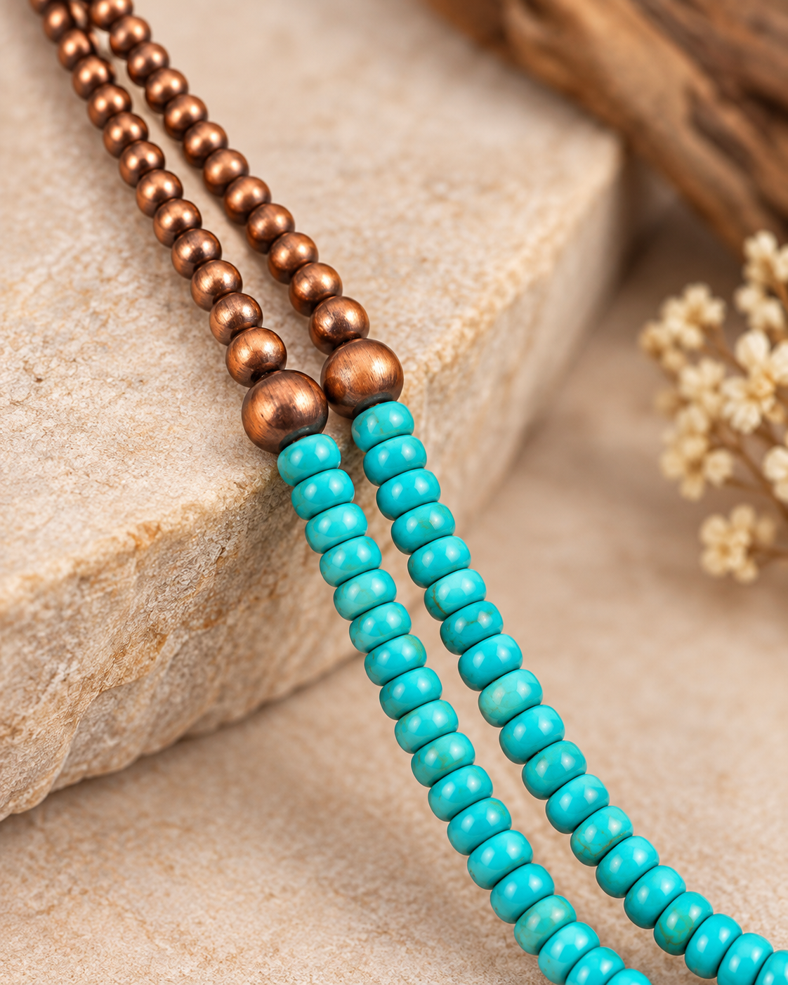 Mesa Trail long layered necklace styled in a cream ceramic tray with soft neutral accessories