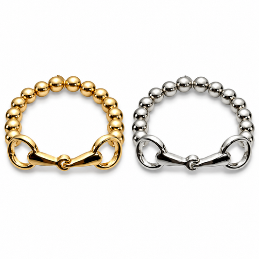 Golden Reins snaffle bit stretch bracelets in gold-tone and silver-tone on white background