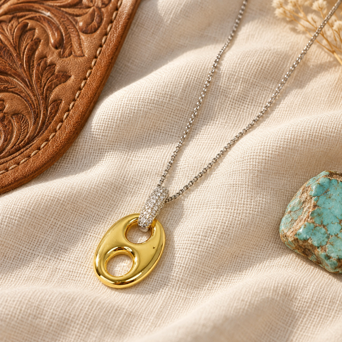 Gold and silver horse bit necklace styled with leather and turquoise