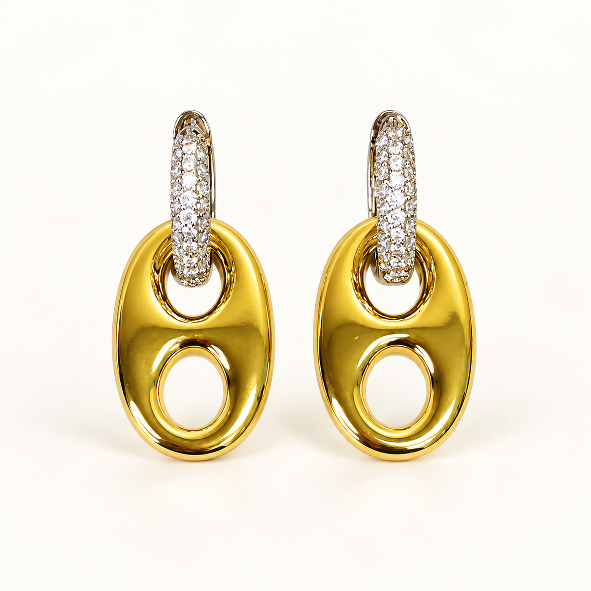 Golden Reins two-tone horse bit drop earrings on a warm-white background