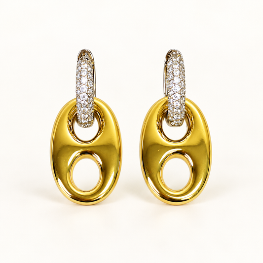 Golden Reins two-tone horse bit drop earrings on a warm-white background