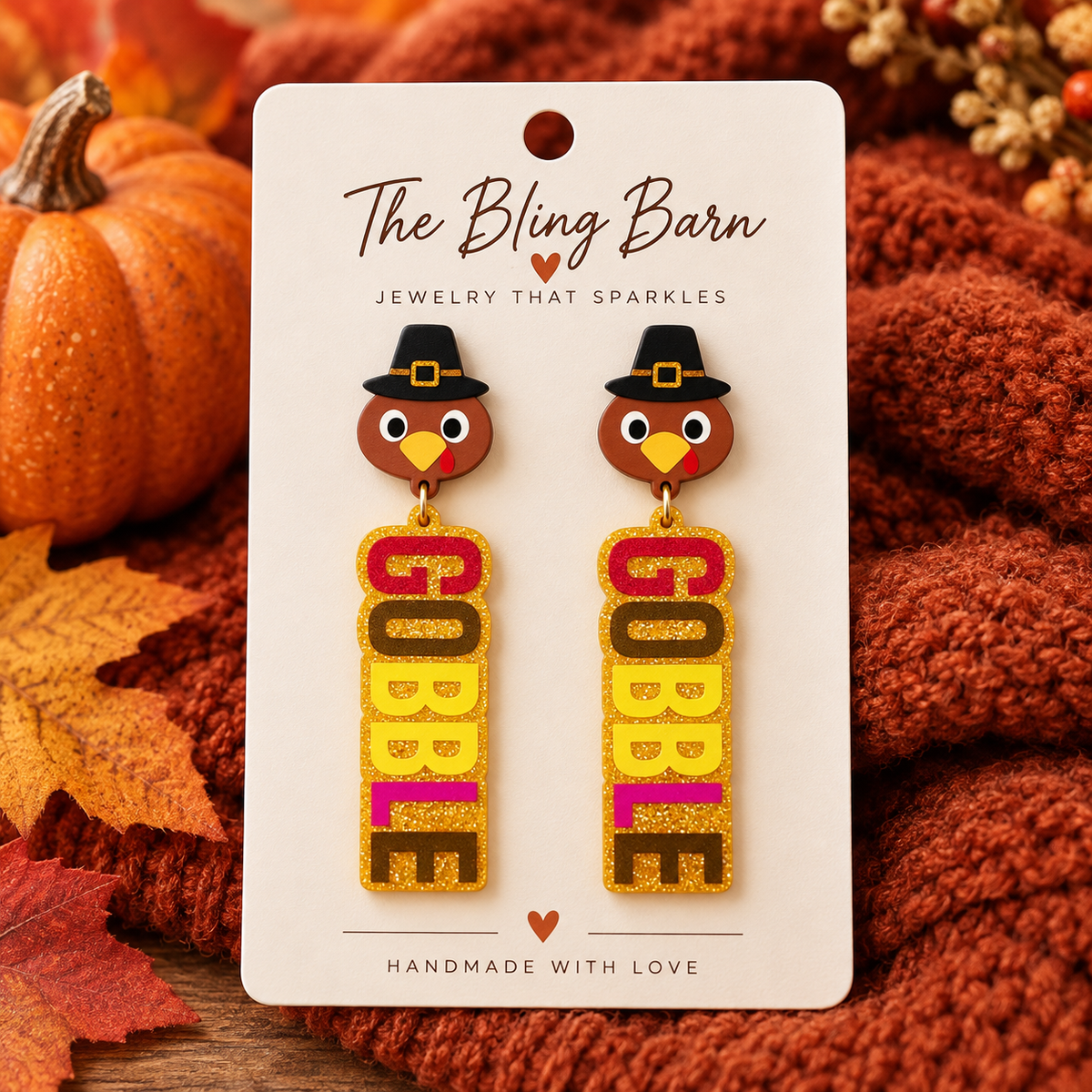 Gobble turkey Thanksgiving earrings displayed on The Bling Barn jewelry card with pumpkins and cozy fall styling