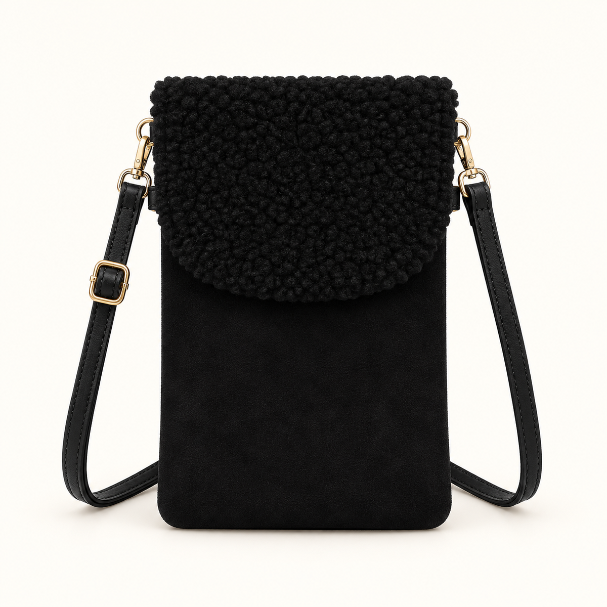Black sherpa-style phone crossbody bag with gold-tone hardware on ivory background