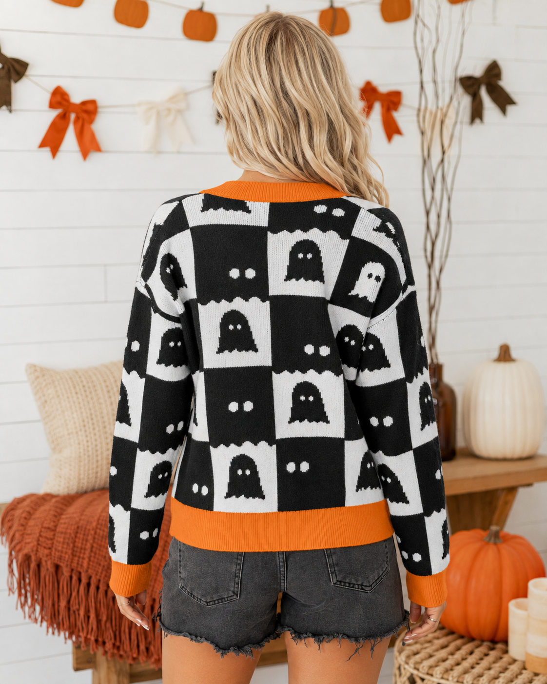 Back view of the After Dark Ghost Check Cardigan showing the black and cream ghost check pattern and orange trim.