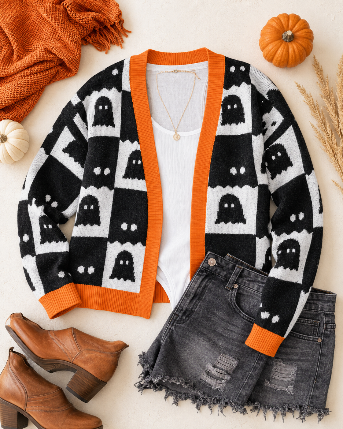 Flat lay styling image of the After Dark Ghost Check Cardigan paired with black denim, a white top, and fall accessories.