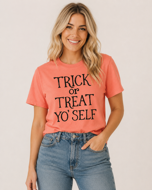 Trick or Treat Yo’Self coral Halloween graphic tee with black lettering on bleach blonde model Emma