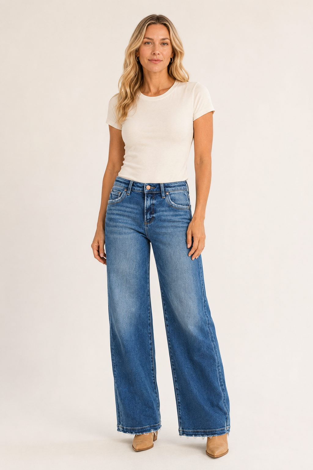 Woman wearing RISEN medium-wash slouchy side-seam jeans