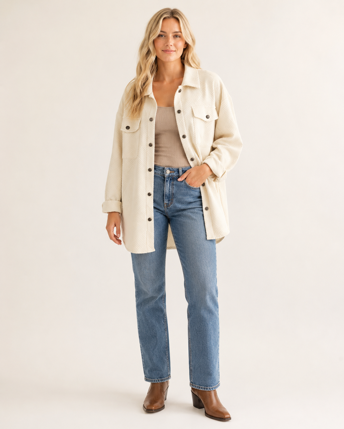 Blonde woman wearing the Canyon Ridge textured button shacket in Ivory with jeans and Western boots