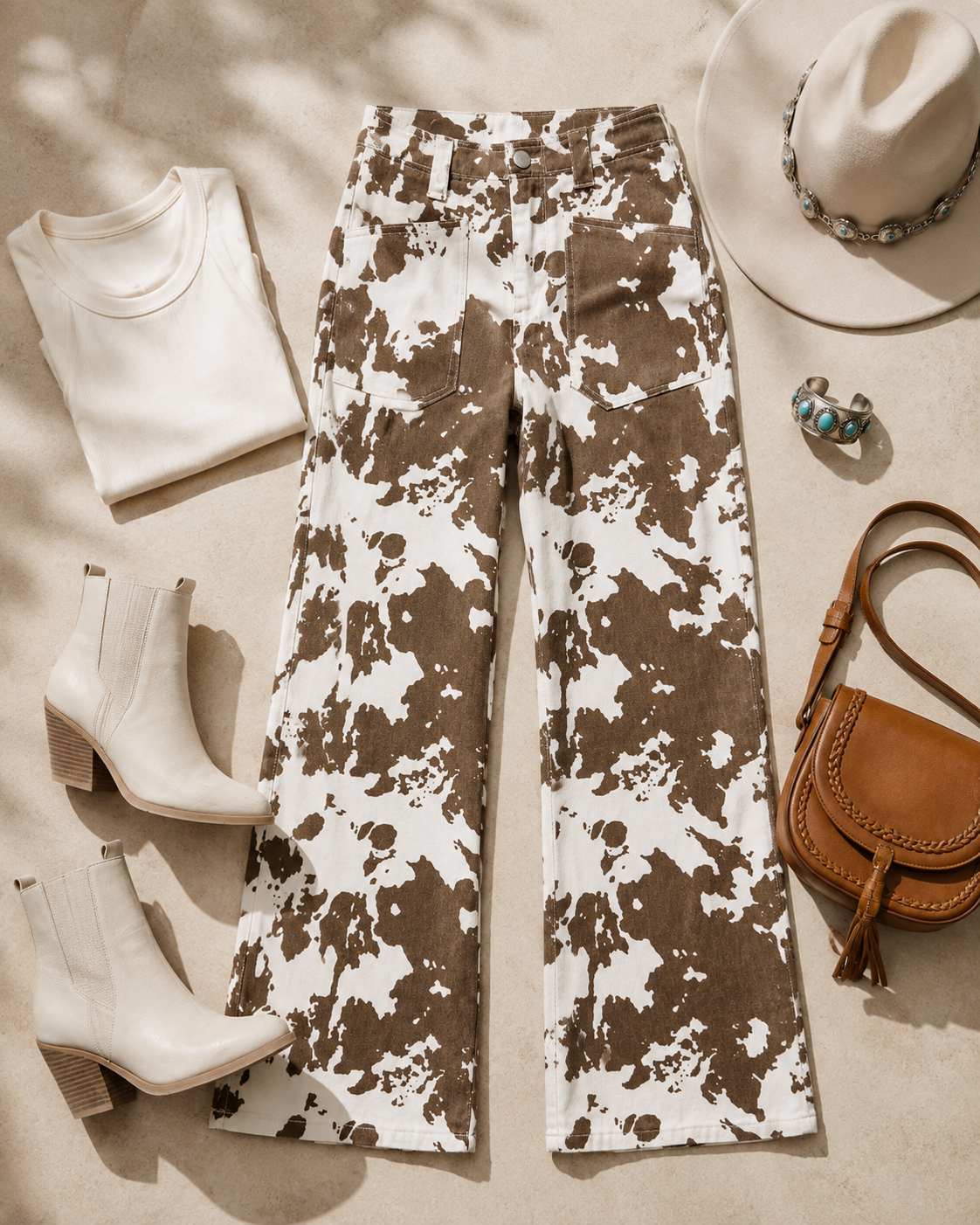 Painted Mesa Western jeans styled with an ivory top, Western boots, hat and leather accessories