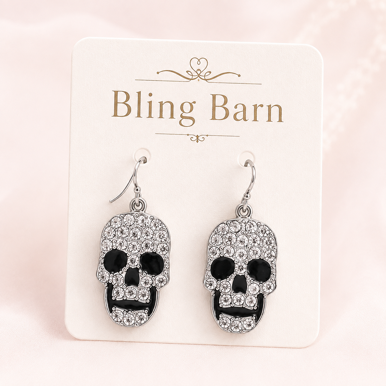 Midnight Skull Rhinestone Earrings displayed on a Bling Barn jewelry card