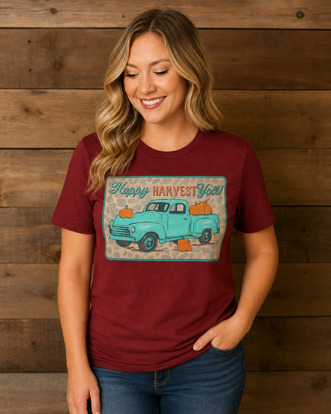 Harvest Roads burgundy graphic tee featuring a turquoise vintage pickup truck, pumpkins and Happy Harvest Y’all lettering on a model
