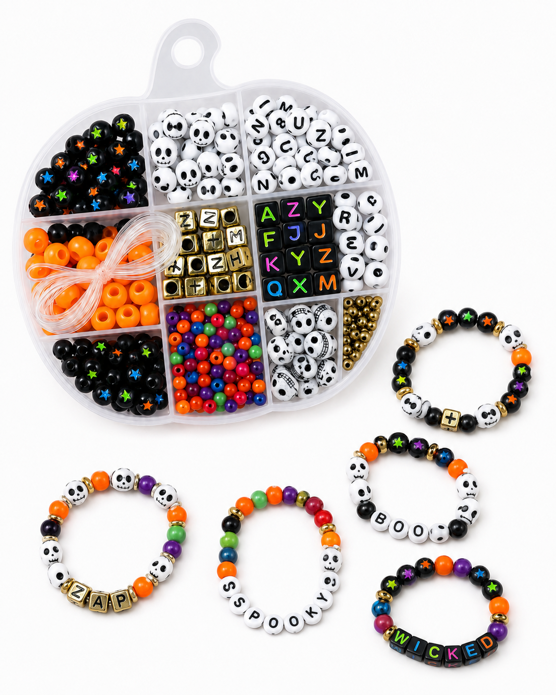 Hands making a Halloween stretch bracelet using skull and star beads from the Spooky Strings DIY kit
