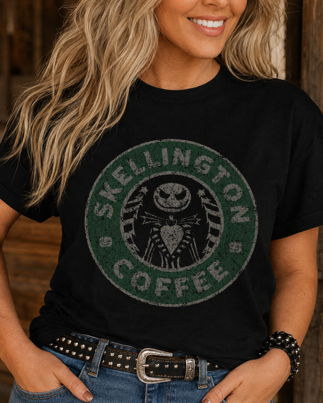 Close-up of Skellington Coffee graphic showing distressed green circular logo and skeleton character on black tee