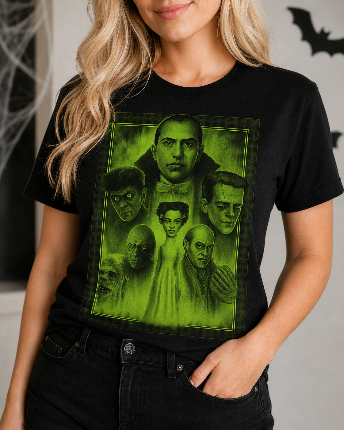 Close-up of Midnight Monsters Glow tee showing vivid green classic monster artwork on a black shirt