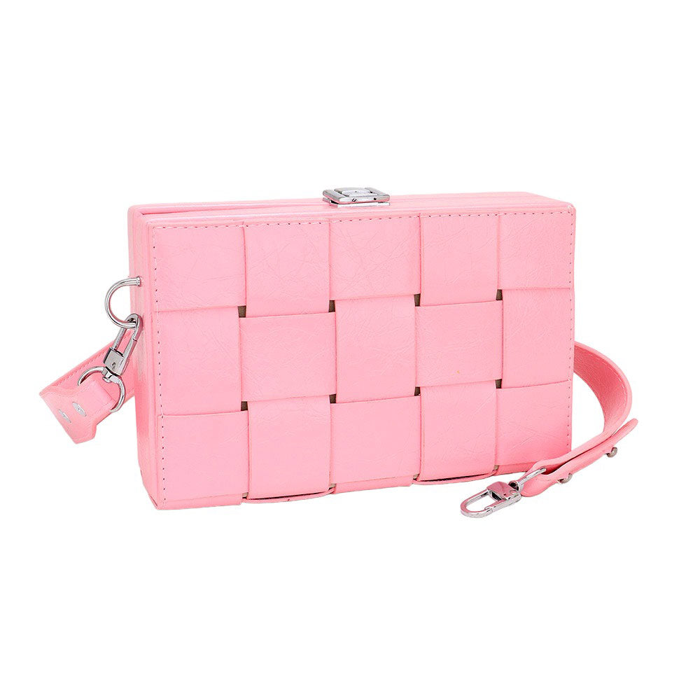 Pink quilted handbag with a strap on a white background