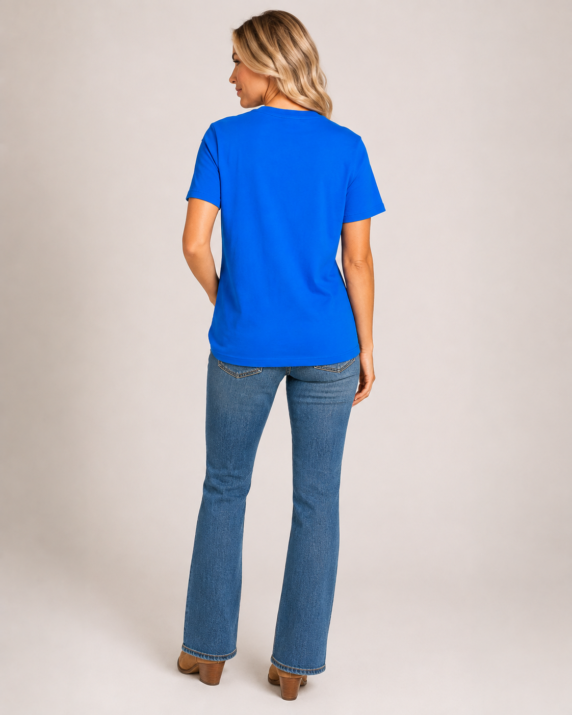 Back view of royal blue Crystal Lake Camp short sleeve tee on bleach blonde model Emma