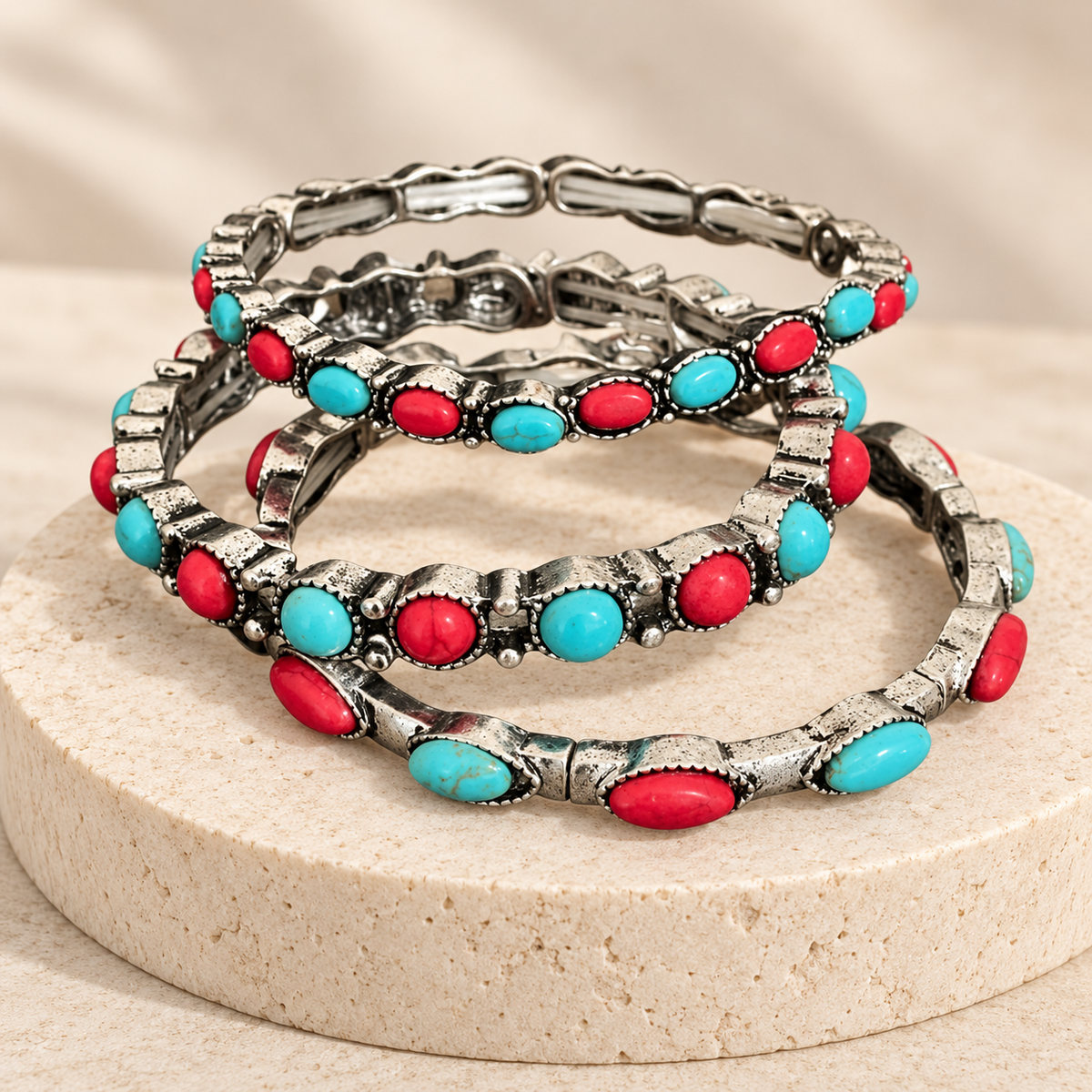 Desert Rodeo three-piece western bracelet set displayed on a neutral stone pedestal