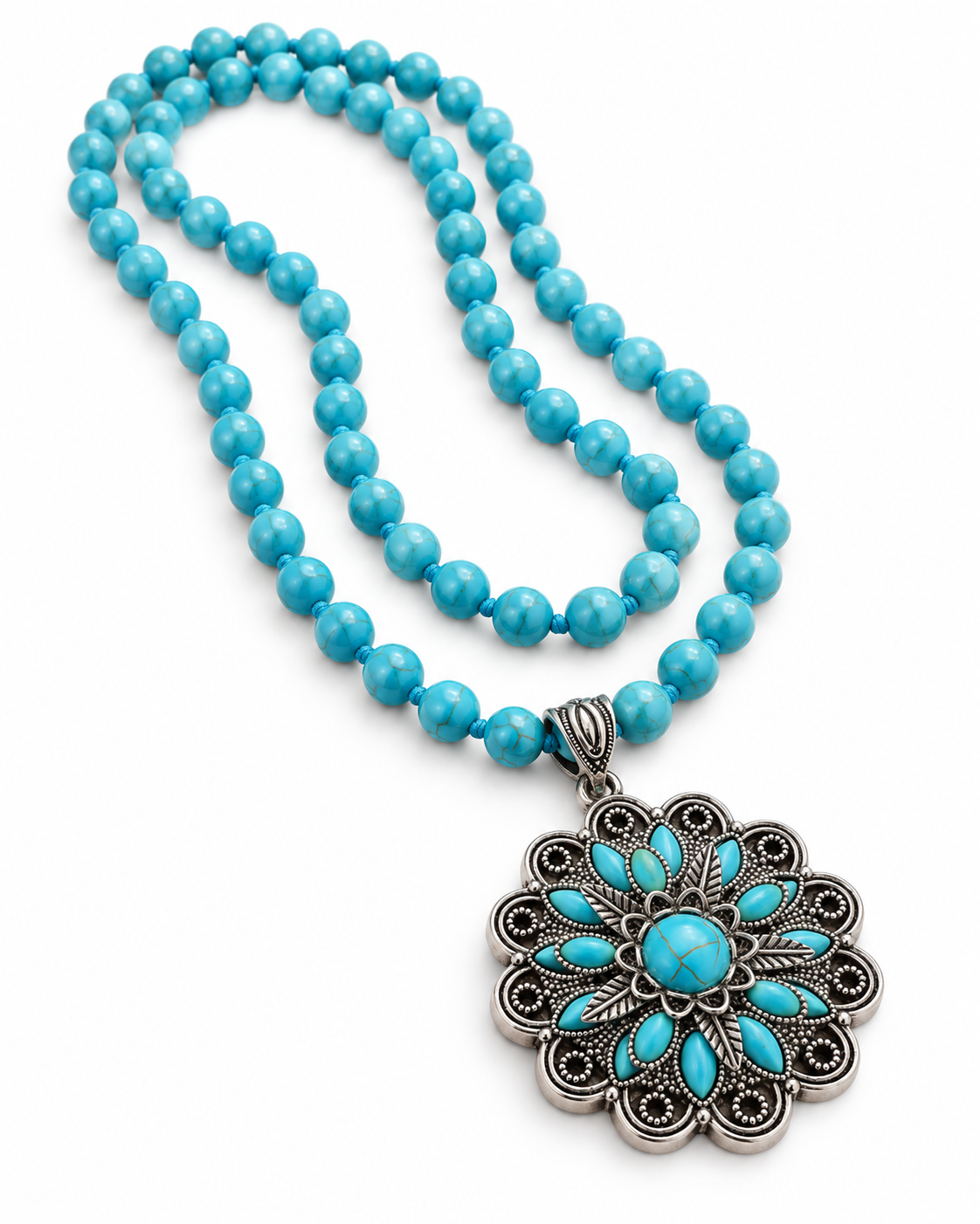 A turquoise and silver beaded necklace with a large floral pendant, displayed on a clean white background.