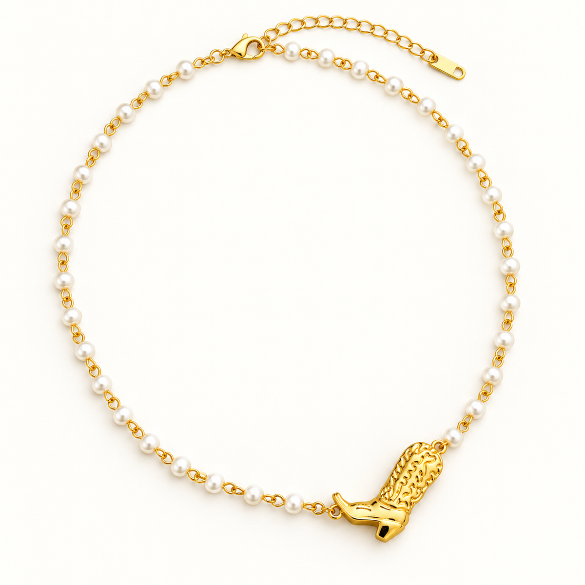 Gold cowgirl boot glass pearl necklace laid flat on a clean ivory background